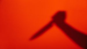 silhouette-hand-with-knife_23-2147685604