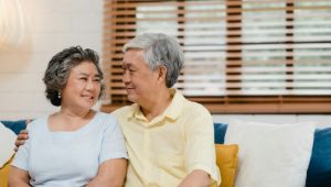 asian-elderly-couple-holding-their-hands-while-taking-together-living-room-couple-feeling-happy-share-support-each-other-lying-sofa-home_7861-1536_compress74.jpg
