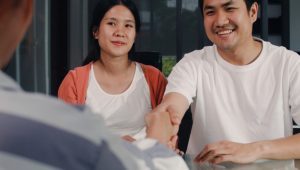 young-asian-pregnant-couple-sign-contract-documents-home-japanese-family-consulting-with-real-estate-financial-advisor-buying-new-house-handshaking-with-broker-living-room-morning_7861-2211.jpg