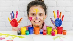 smiling-portrait-girl-table-with-paint-bottles-showing-her-hand-face-painted-with-colors_23-2148088494_compress61.jpg