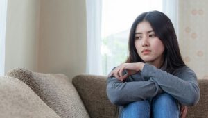 unhappy-asian-pretty-young-woman-siting-alone-couch-with-feeling-sadness_1150-15514_compress70.jpg