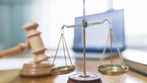 close-up-golden-justice-scale-courtroom_23-2147876801.jpg